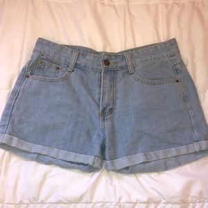 High waisted, light wash denim shorts.